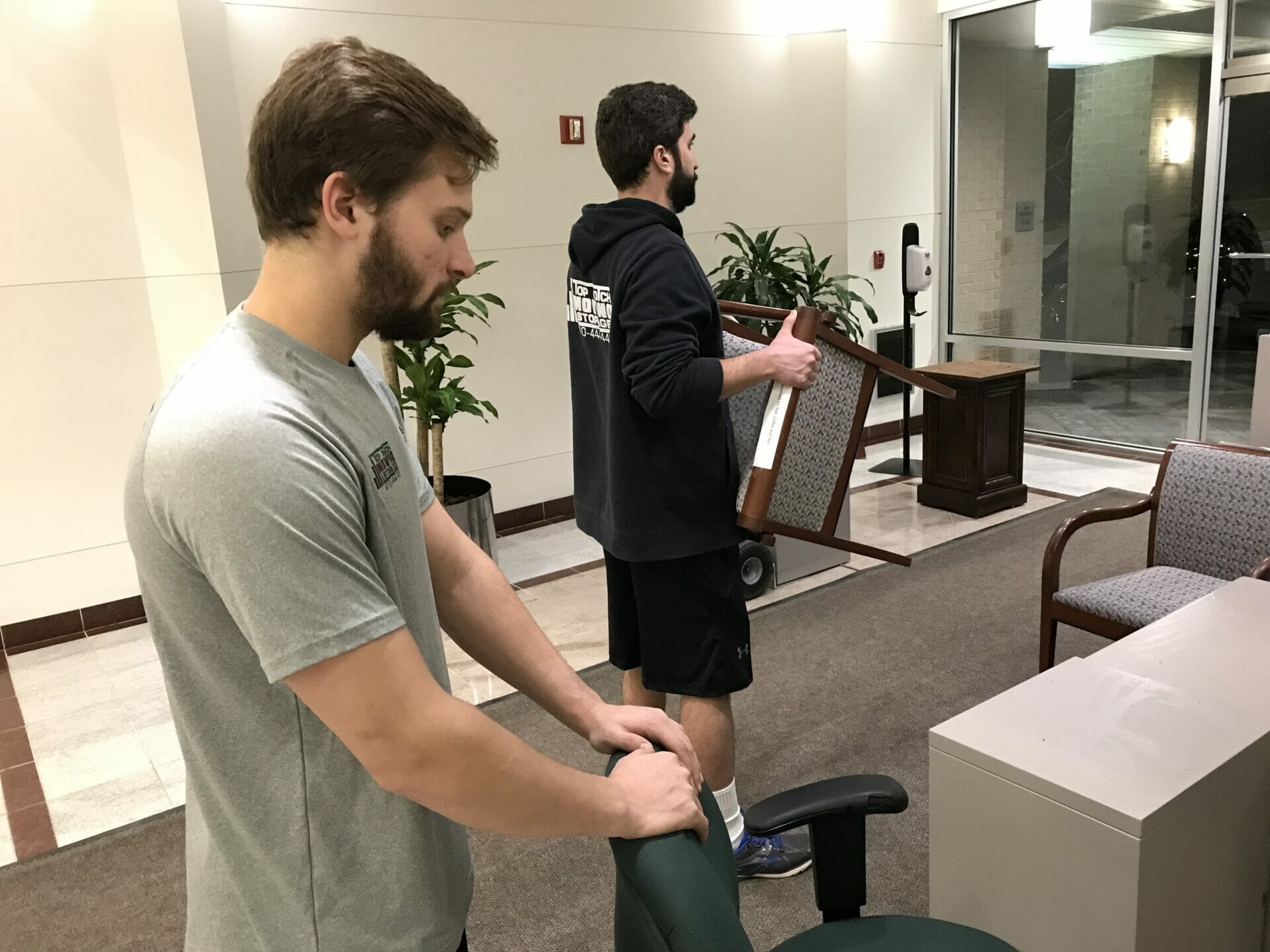 The team moving office chairs