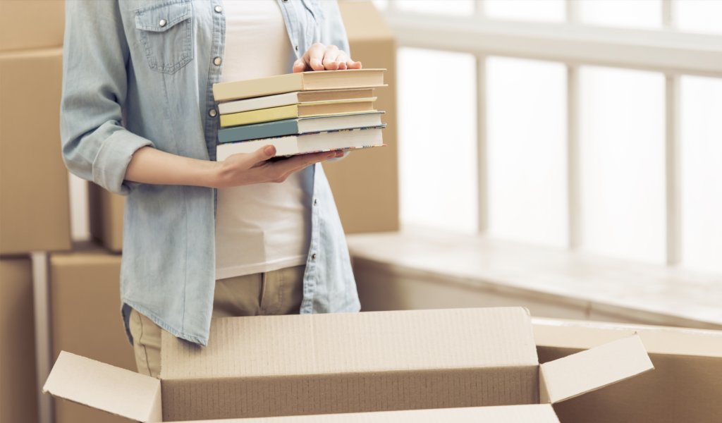 packing books into boxes